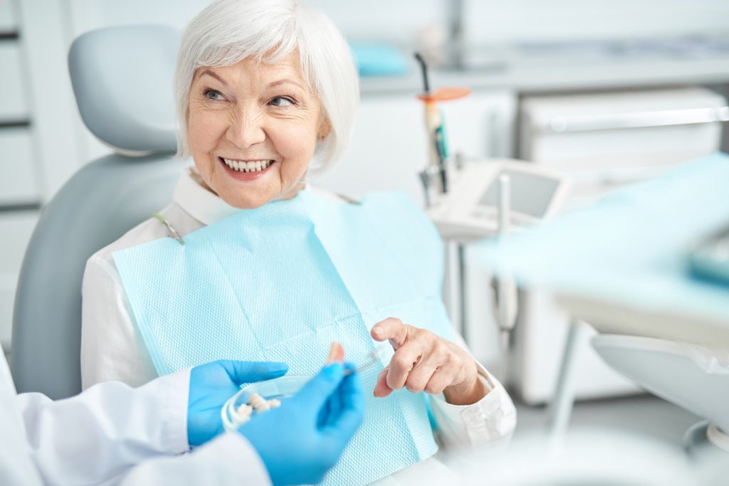 Smiling,Elderly,Woman,Looking,At,Her,Doctor,Stock,Photo