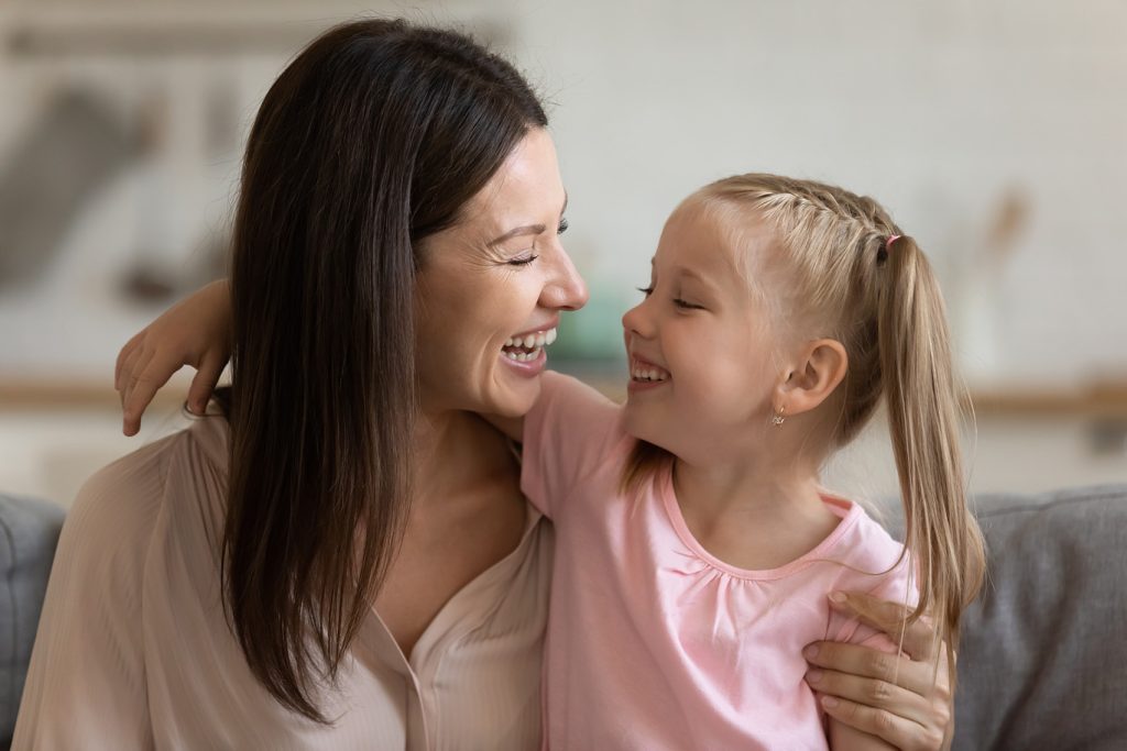 Cheerful,Young,Mom,Embracing,Adorable,Cute,Little,Daughter,Laughing,Having