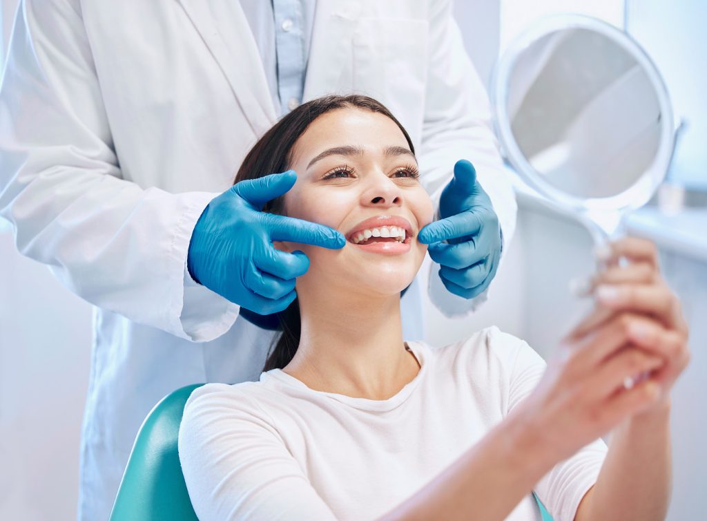 Dental,Consultation,,Mirror,And,Woman,With,Smile,After,Teeth,Whitening,