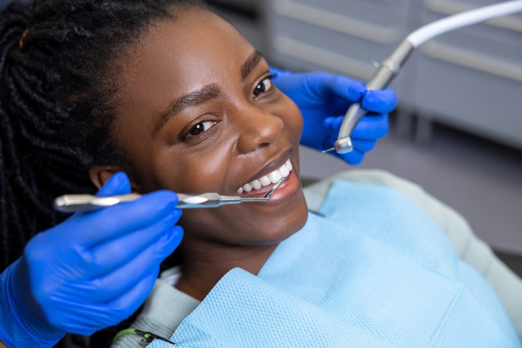 Multicultural,Lady,In,Dental,Clinic,Doing,Teeth,Checkup