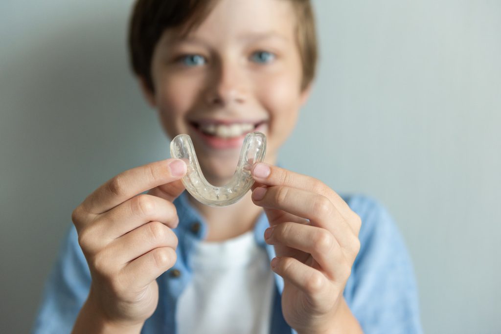 Smiling,Boy,With,Braces,And,Invisalign,And,Mouthguard,Concept.,Orthodontic