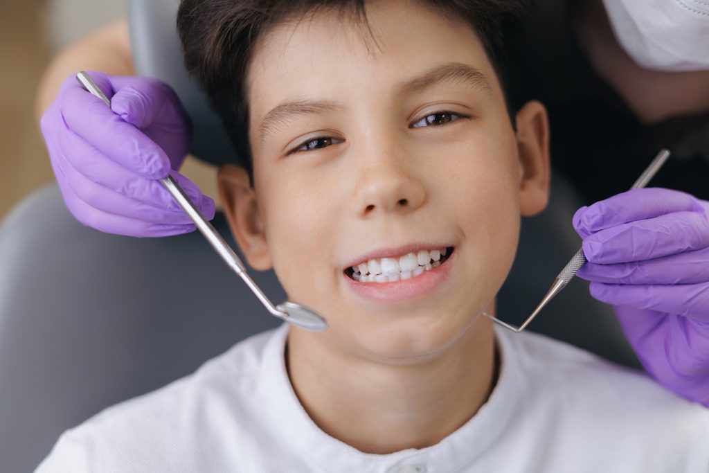 Portrait,Happy,Young,Caucasian,Male,Teen,Smiling,During,Dental,Checkup