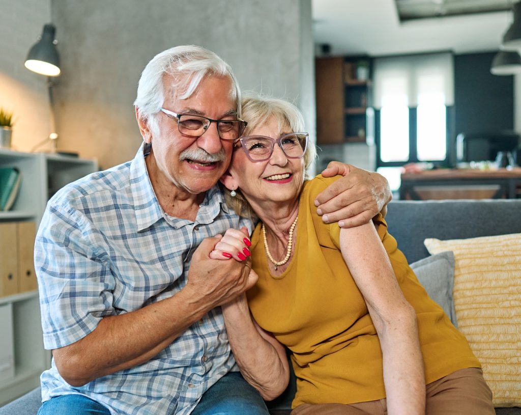 Portrait,Of,A,Happy,Senior,Couple,Embracing,Talking,At,Home