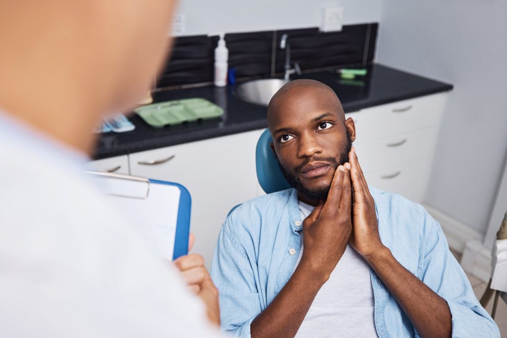 Toothache,,Consulting,And,Man,With,Dentist,In,Chair,For,Teeth