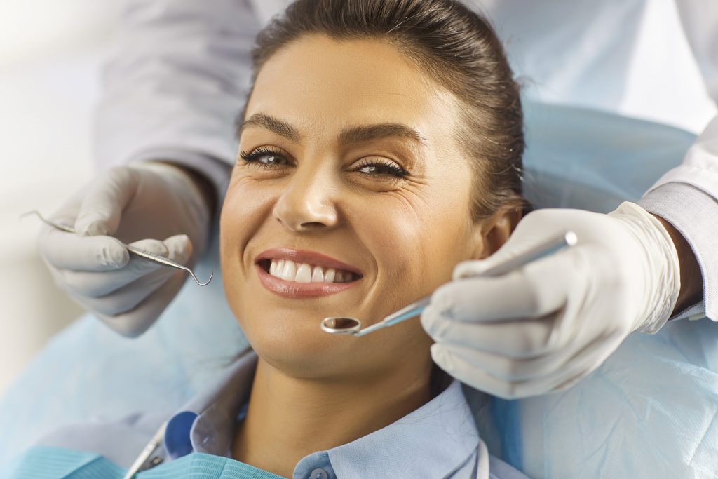 Woman,Smiles,Confidently,,Showing,Off,Her,Healthy,White,Teeth,,During