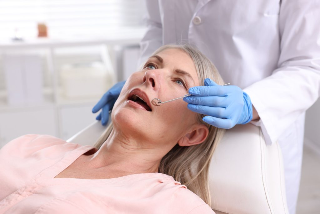 Dentist,Checking,Woman's,Teeth,In,Clinic,,Closeup